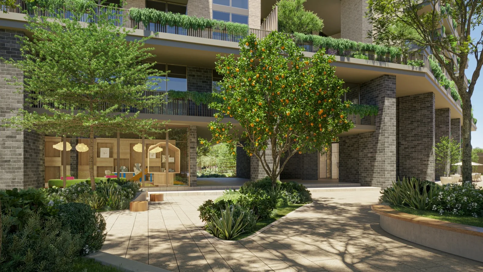 Landscaped outdoor arrival lobby framed by greenery